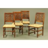 Four commonwealth style oak dining chairs, with carved rectangular backs,