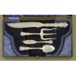 A Victorian silver plated condiment set, bread, bun and butter, in plush lined case.