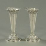 A pair of silver trumpet shaped vases, repousse with scrollwork, 1900, maker Fenton Brothers Ltd,