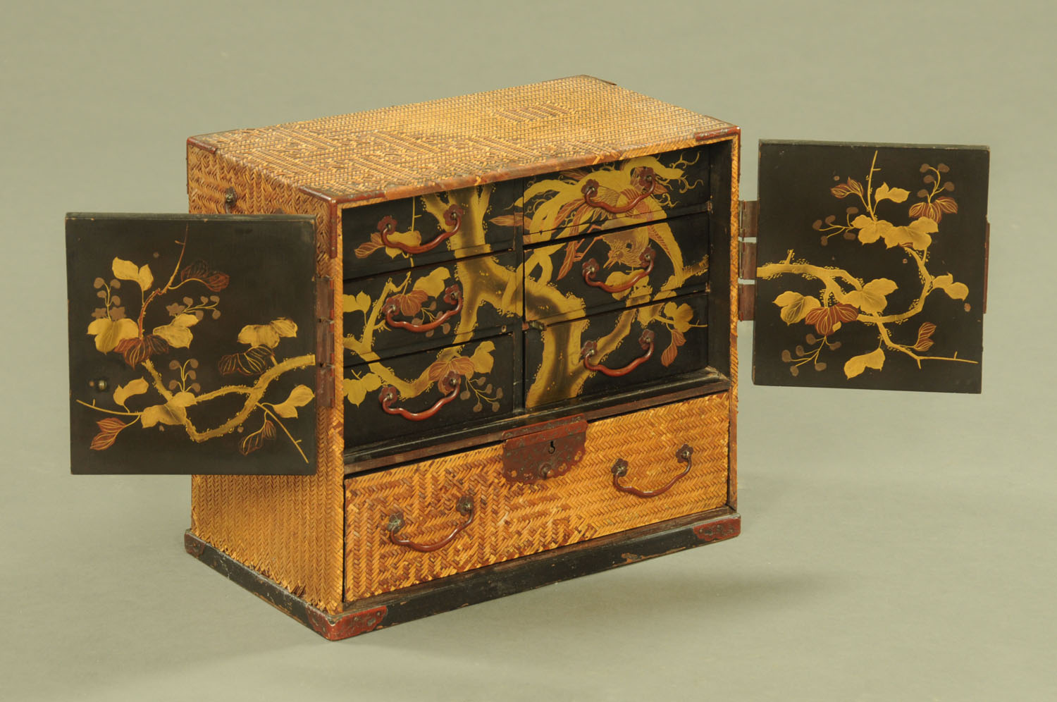 A Japanese lacquered tabletop cabinet, late 19th century. Width 30 cm.