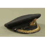 A World War II Naval Commanders cap by Gieves Ltd., London.