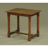 An 18th century oak side table,