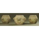 Three Chinese carved stone garden seats, with lion mask and ring carved decoration.