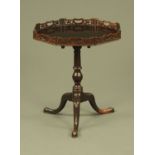 A mahogany tripod table,