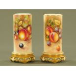 A pair of Royal Worcester porcelain cylindrical vases,