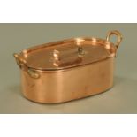 A 19th century lidded copper fish kettle. Width across handles 50 cm.