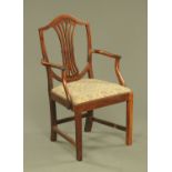 A 19th century mahogany armchair, with pierced splat back, arched top rail and drop in seat.