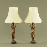 A pair of composition figural table lamps, each with shade. Height excluding light fitting 40 cm.