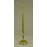 A lacquered lamp standard, green foliate patterned with circular base. Height 151 cm.