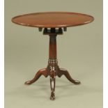 A George III mahogany tripod table with bird cage, with dished top,
