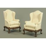 A pair of wing easy chairs,