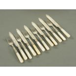 A set of six silver plated Victorian mother of pearl handled fruit knives and forks.