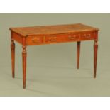 A Regency style mahogany writing table, with brown tooled leather writing surface,