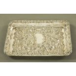 An Edwardian silver tray, repousse with foliate scrolls, Birmingham 1902 maker Spurrier & Co.