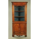 A George III oak and mahogany standing corner cupboard, the upper half glazed,