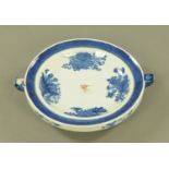 A Chinese blue and white circular food warmer, with bird armorial to centre. Diameter 25 cm.