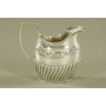 A late Victorian silver cream jug by Josiah Williams & Co (George Maudsley Jackson) London 1882.