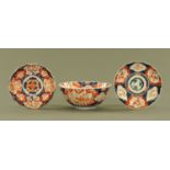 A 19th century Japanese Imari bowl, and two plates. Bowl diameter 24.5 cm.