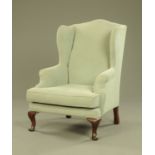 A Queen Anne style mahogany wing easy chair,