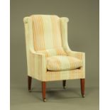 An Edwardian mahogany easy chair,