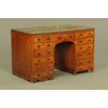 A Victorian mahogany fixed pedestal desk,