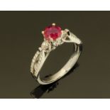 An 18 ct white gold ruby and diamond ring, ruby +/- 8.6 carats, diamonds +/- 0.
