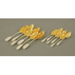 A matched set of six silver gilt berry spoons, three,