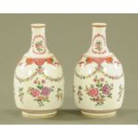 A pair of porcelain vases, decorated with chrysanthemum and floral swags. Height 24 cm.