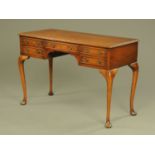 A mahogany kneehole desk or dressing table,