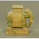 A Chinese Qing dynasty elephant garden seat. Width 52 cm.