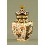 A Royal Crown Derby lidded vase, with printed mark to base. Height 14.5 cm.