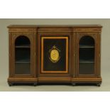 A Victorian ebonised and amboyna wood inverted breakfront credenza,