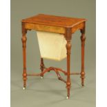 A Victorian walnut worktable, the inlaid hinged top opening to a fitted interior with fretwork lids,