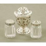 An early Victorian silver pepper pot with pierced body and glass liner,