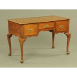 An early 20th century oak desk or dressing table,