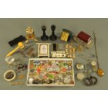 A shoebox containing a quantity of miscellaneous jewellery, gavel, ebony candlesticks, corkscrew,