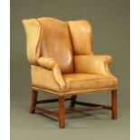 A George III style wing easy chair,