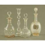 Three cut glass decanters together with a single glass candlestick. Tallest 30 cm.