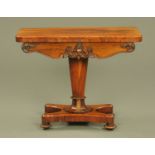 An early Victorian rosewood turnover top games table,