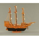 A model galleon, hand built, timber with rigging, last quarter 20th century. Length 79 cm.