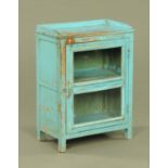A blue painted pine cabinet, with single door and raised on stile feet.