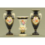 Three Meissen porcelain vases, comprising a pair with blue ground decorated with floral sprays,