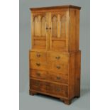 A George III oak cupboard on chest,