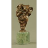 A bronze figure of a shrouded female, raised on a cylindrical base, signed. height 18 cm.