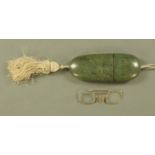 A 19th century shagreen spectacle case, containing a pair of Pinchbeck spectacles. Length 16 cm.