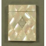 A 19th century mother of pearl card case, with silver coloured diamond lozenge. 10 cm x 8 cm.