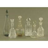 Six decanters, four cut glass, one moulded and one plain.