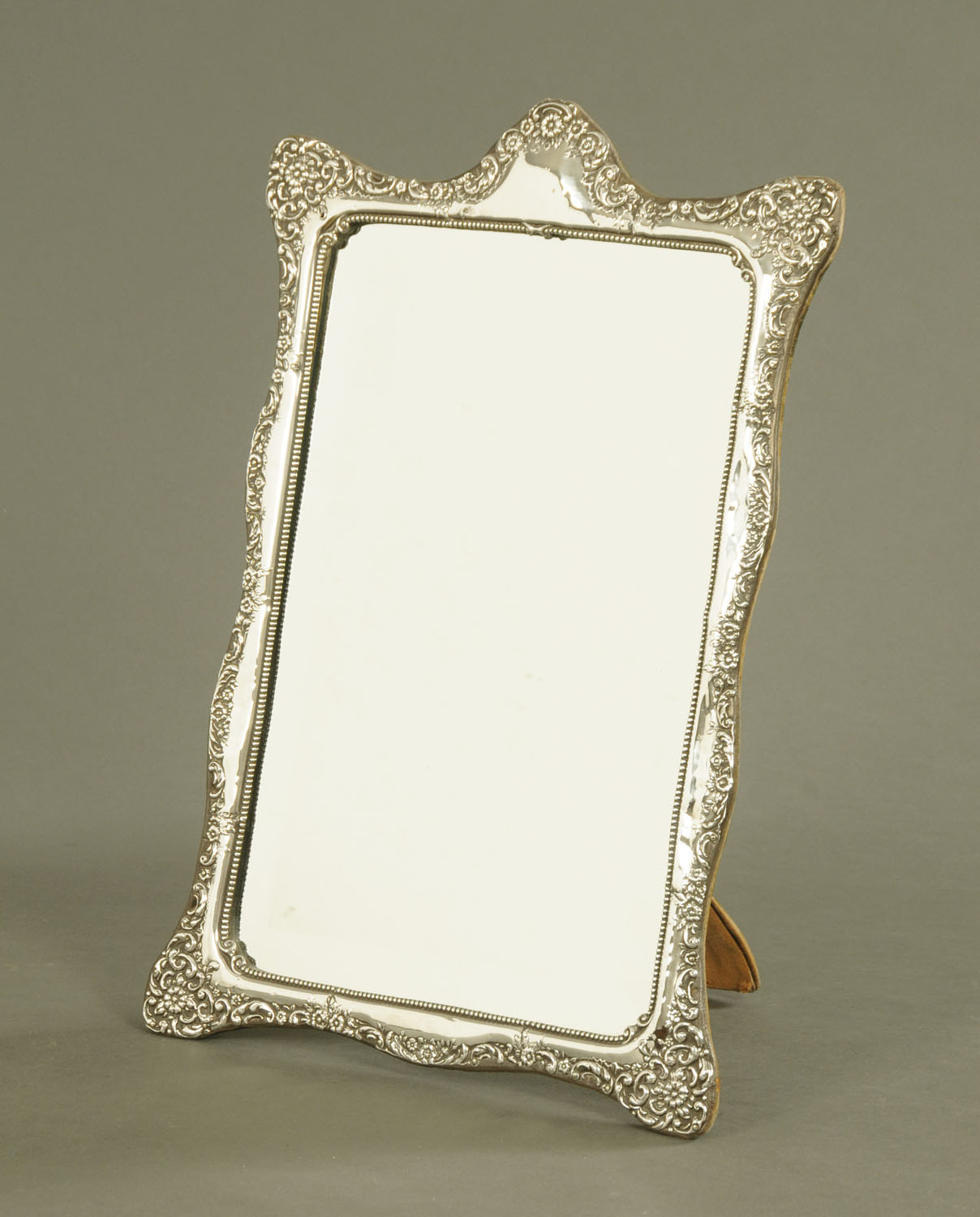 A late Victorian silver framed easel backed mirror, with bevelled glass, Chester hallmark 1901.