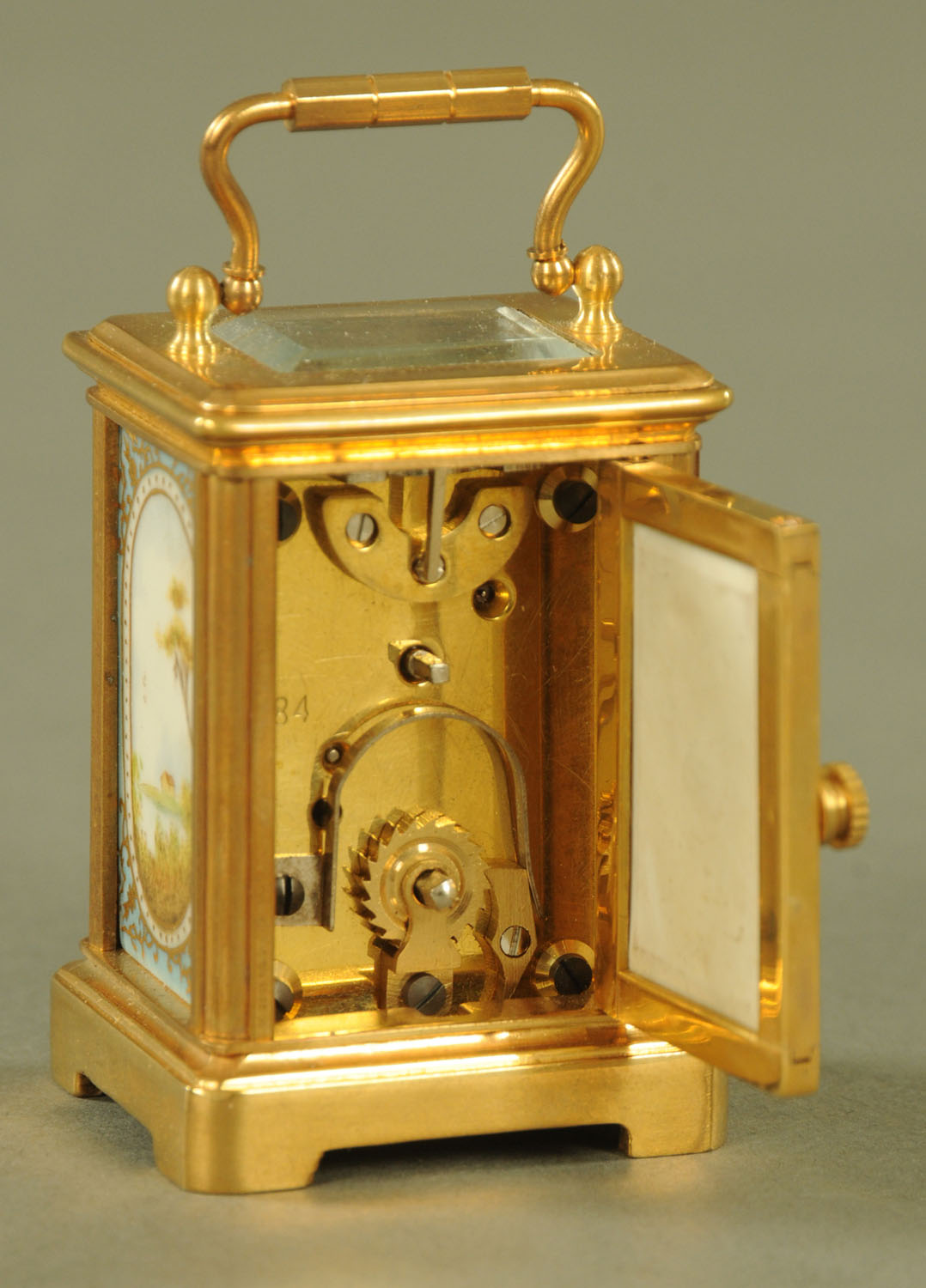 A miniature brass carriage clock, with porcelain panels, timepiece only. - Image 6 of 6