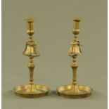 A pair of 19th century brass tavern candlesticks, each with integral bell. Height 33 cm.